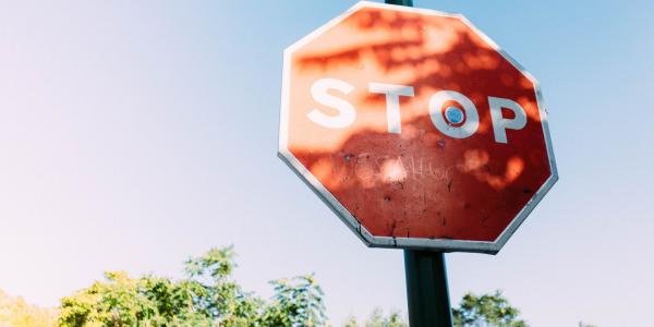 Stop Written on a traffice sign board